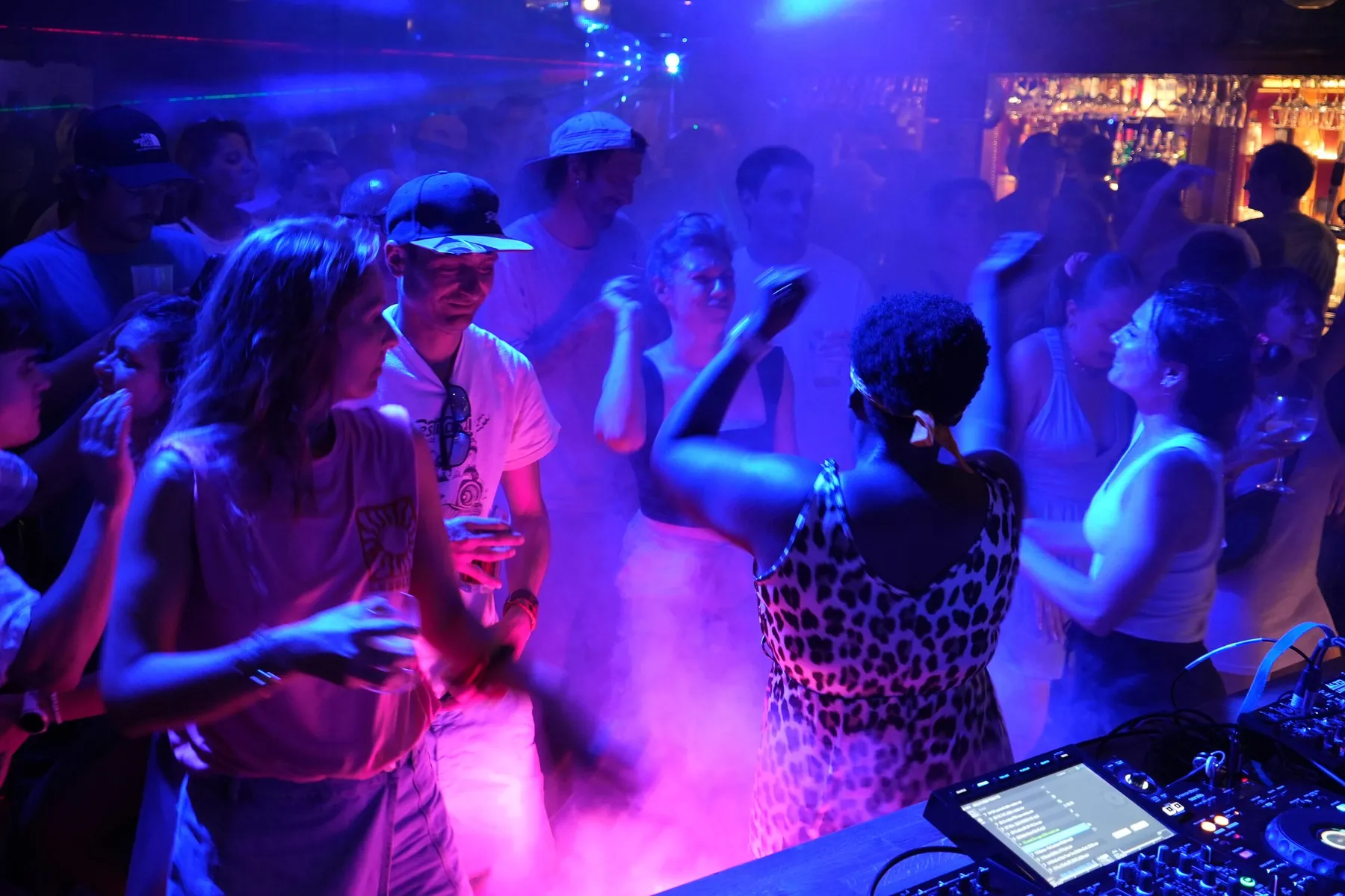 The Molly’s Pub dance floor on a DJ night, dancers in the smoke and blue light