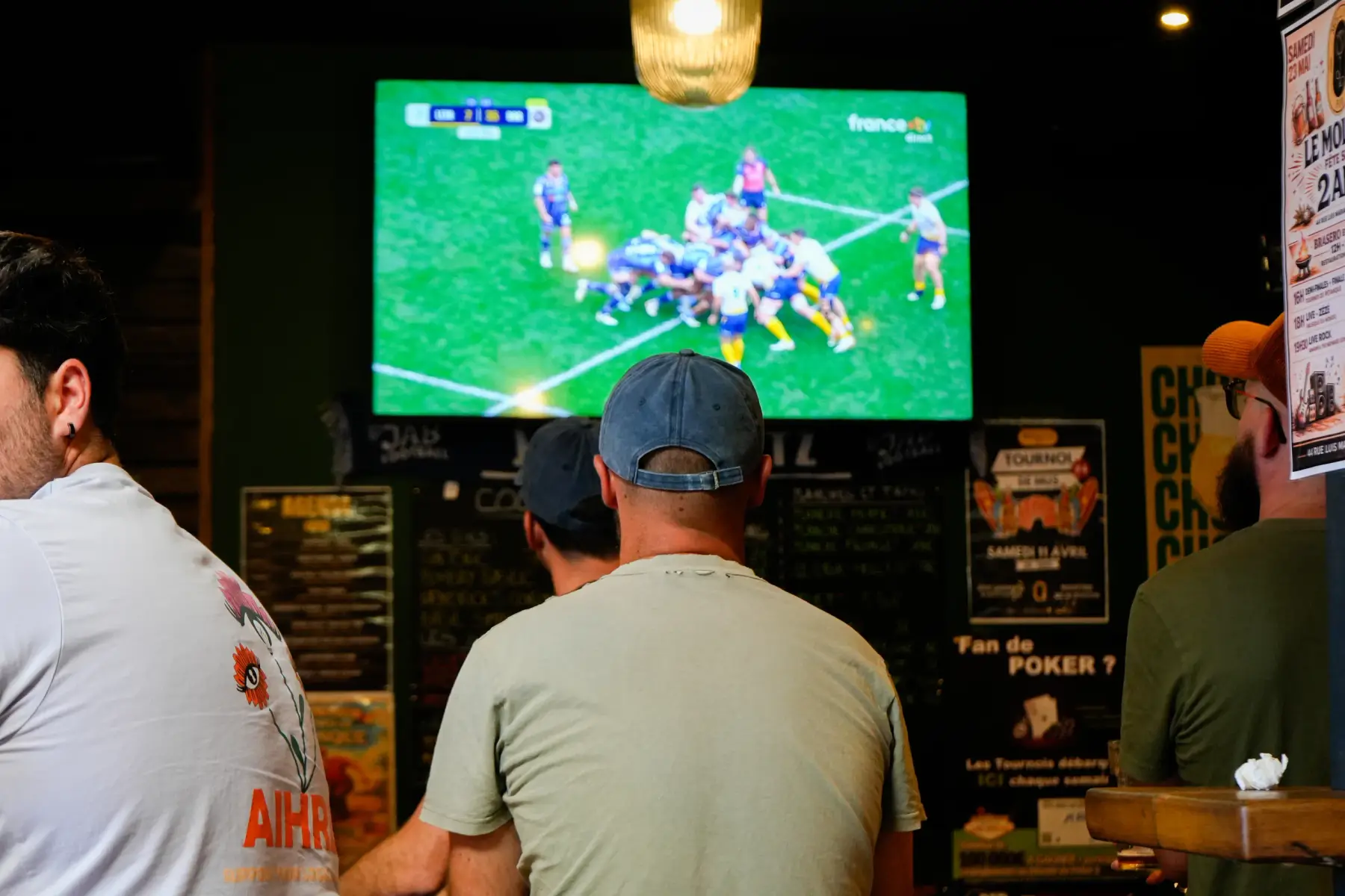 A table watching a rugby match on the big screen at Molly’s Pub